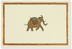 an elephant painted on the side of a white wall with gold trimmings and a colorful