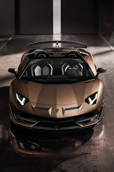 a brown sports car parked in a garage