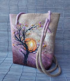 a purse with a tree painted on it