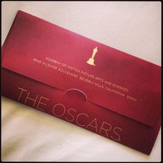 a red envelope with the oscars logo on it