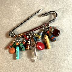 a bunch of charms hanging from a hook