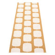 an orange and white runner rug with squares on the bottom, in front of a white background