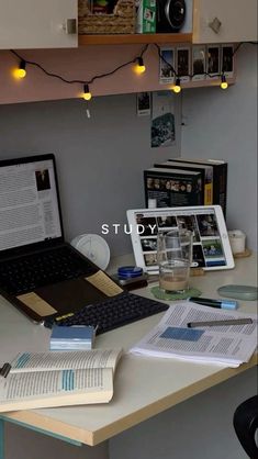 a laptop computer sitting on top of a desk