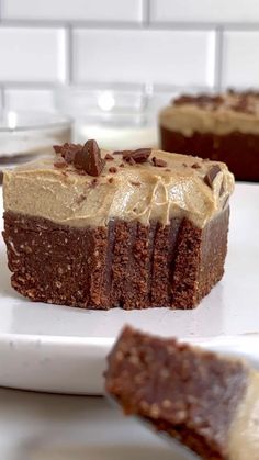 two pieces of chocolate cake on a white plate