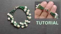 the beaded bracelet is being made with green and white beads, which are attached to a