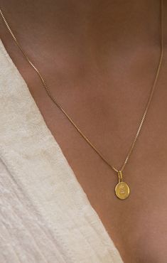 Based on Rosemonde Gerard’s 19th century French poem, the Love Token Necklace is stamped with the French sentiment 'qu'hier que demain'. It is a symbol of growing love which translates from the poem’s French verse meaning “I love you more than yesterday and less than tomorrow”. Whether an expression of self-love, romance, or friendship, this pendant is as meaningful as it is franco-chic. Material Pendant is 14k gold plated sterling silver with cz. 14K gold filled box chain is 18” + 2.5” extender Pendant Necklace Outfit, Minimal Pendant, Gold Minimalist Jewelry, Necklace Outfit, Preppy Jewelry, Pendant Necklace Simple, Gold Necklace Simple, Gold Chain With Pendant, French Jewelry