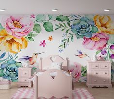 a child's room with flowers painted on the wall and dressers next to it