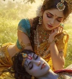 a beautiful woman laying on the ground next to a man with makeup painted on his face