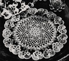 an old black and white photo with crocheted doily