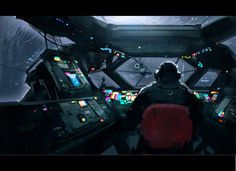 a sci - fi space station with many monitors and lights on the ceiling, as well as a man in a black suit