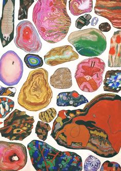 an image of colorful rocks and pebbles on white paper