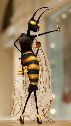 a figurine is dressed as a bee