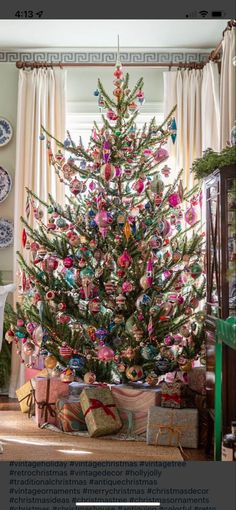 a decorated christmas tree with presents under it