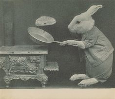 an old photo of a rabbit cooking food