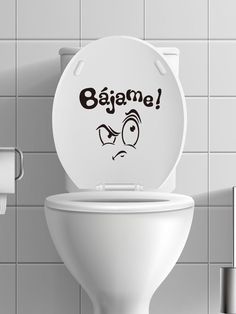 a toilet with a sticker on the lid that says bajame in front of it