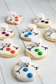 decorated sugar cookies with frosting and icing on white wood planks, ready to be eaten