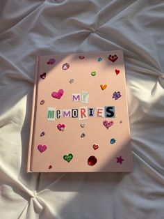 Light pink scrapbook with newspaper lettering spelling My Memories. Decorated with aesthetic heart stickers and jewels. Memories Scrapbook, Organizator Grafic, Album Journal, Scrapbook Cover, Memory Journal, Seni Dan Kraf, Cover Journal, My Memories, Scrapbook Book