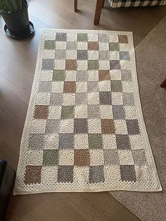 a living room with a couch and rug on the floor