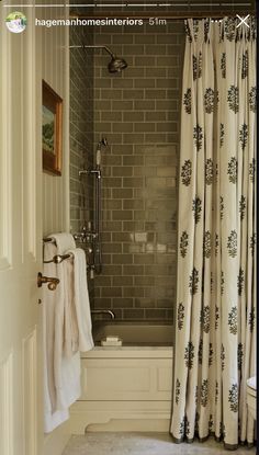 a bathroom with a shower, toilet and bathtub