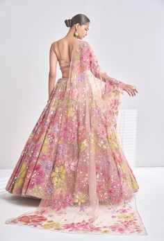 This coffee net lehenga features bright floral applique motifs along with the sprinkling of sequin and crystals. The strappy blouse and dupatta are full embroidered. From Seema Gujral’s Samode collectionDELIVERY TIMEPlease wait 8-12 weeks for your outfit to arrive.FABRIC DETAILSNetProfessional cleaning only. Bridal Floral Lehenga, Guest Lehenga Look, English Colour Lehenga, Shaadi Lehenga For Sisters, Unique Indian Outfits Style, Floral Lehenga Designs, Unique Indian Outfits, Trending Lehenga Designs