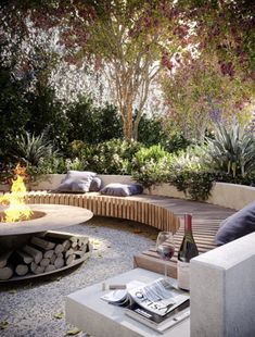 a fire pit in the middle of a garden