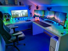 a room with three computer monitors and two keyboards on the desk in front of them