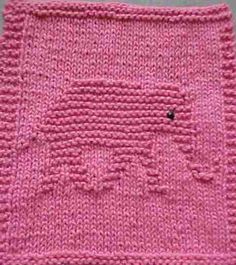 a pink knitted square with a black hole in the middle and small holes at the center