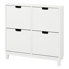 a white cabinet with two drawers and black handles on the bottom, against a white background