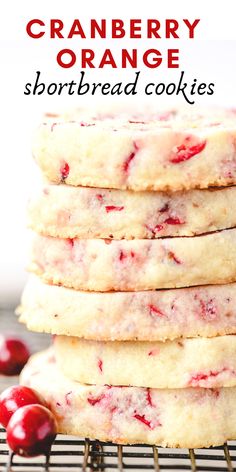 cranberry orange shortbread cookies stacked on top of each other