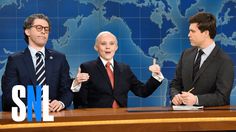 three men in suits and ties stand behind a desk with a world map on it