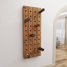 a wall mounted wine rack with bottles on it