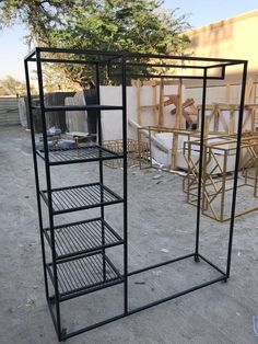 a metal rack with several shelves on top of it