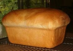 a loaf of bread sitting on top of a cooling rack