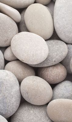 many white and gray rocks are stacked together