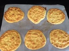 six biscuits on a baking sheet ready to be baked