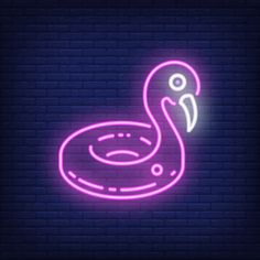 a flamingo neon sign on a brick wall