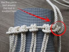 the first piece tied around the mat is knotted here with two red circles in front of it