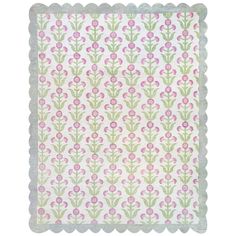 a pink and green flowered design on white paper with scalloped edges,