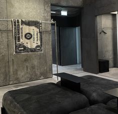 a living room filled with lots of furniture and walls covered in money bills hanging on the wall