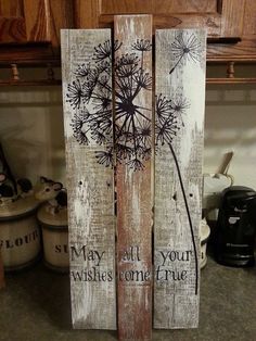 two wooden signs with dandelions painted on them in the shape of letters that read, may all your wishes come true