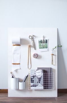 a white wall with various items on it