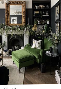 a living room filled with furniture and a fire place covered in greenery next to a fireplace