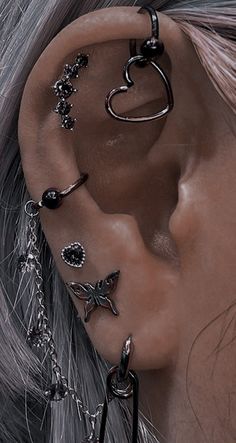 an ear piercing with multiple pieces of jewelry attached to it