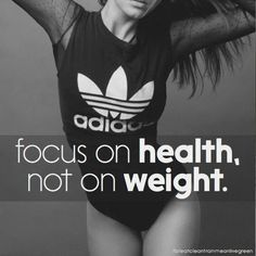 a woman in a black adidas bodysuit with her arms behind her head and the words focus on health, not on weight