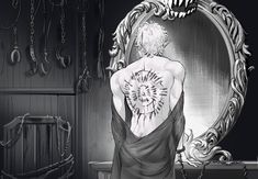 the back of a woman's body in front of a mirror with chains hanging from it