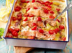 a dish with salmon and cherry tomatoes in it