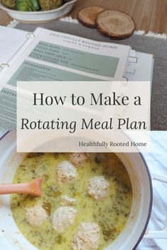 a white bowl filled with meatballs and broccoli next to a recipe book