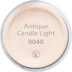 an empty jar with the words antique candle light written on it's lid and bottom