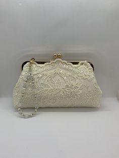 a white purse sitting on top of a table