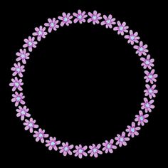 a circle made out of pink flowers on a black background